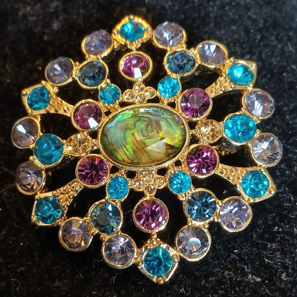 Elegant Goldtone and Multicolor Brooch With Abalone Look Center